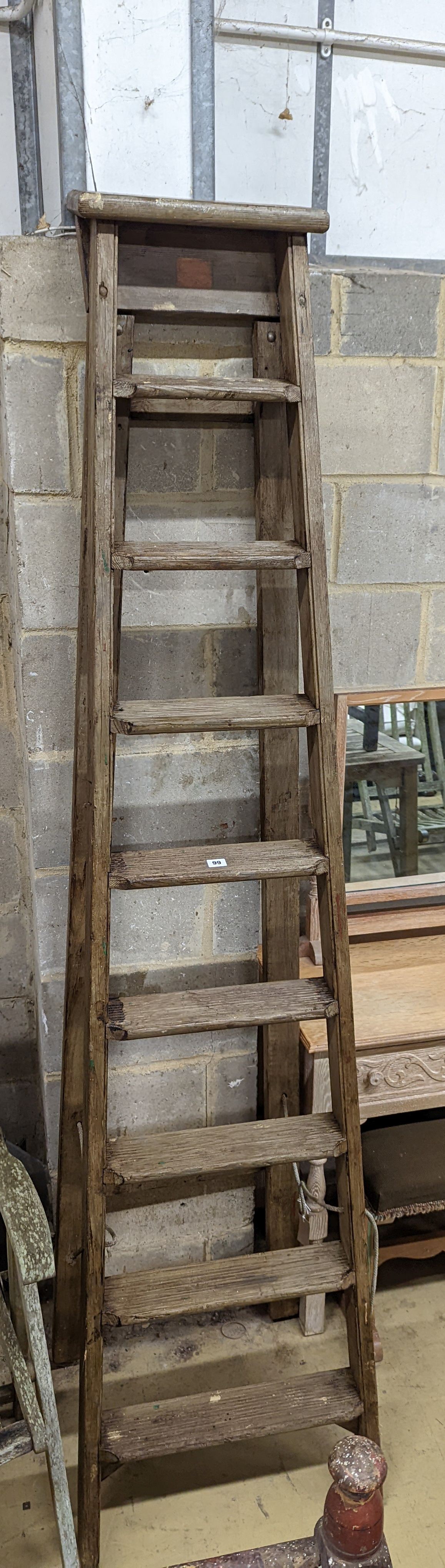 A vintage 8 tread wooden step ladder. H-224cm.